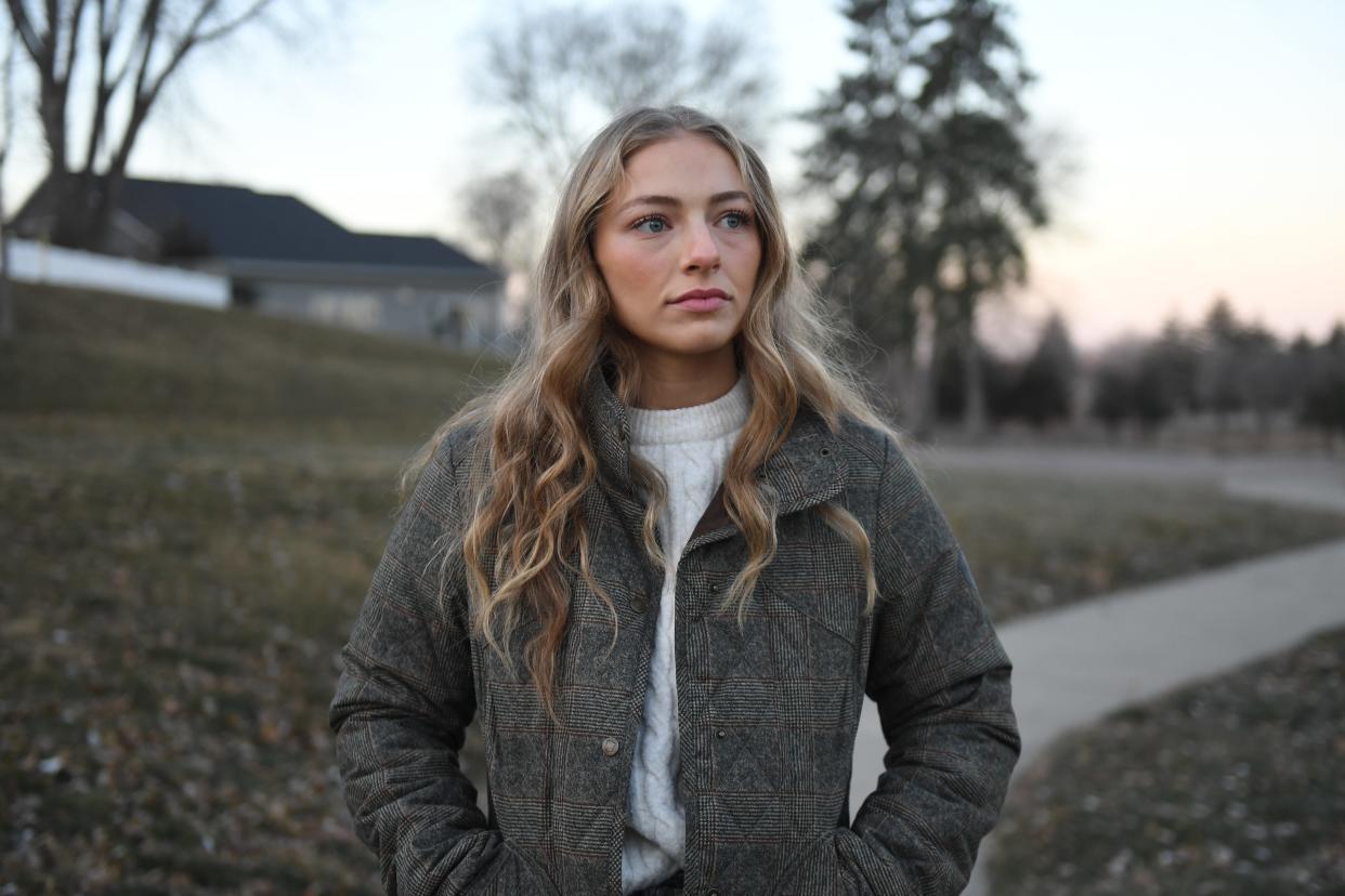 Former fifth grade teacher Nicole Mutchler poses on a walkway on Thursday, Dec. 14, 2023 at Terrance Park in Sioux Falls.