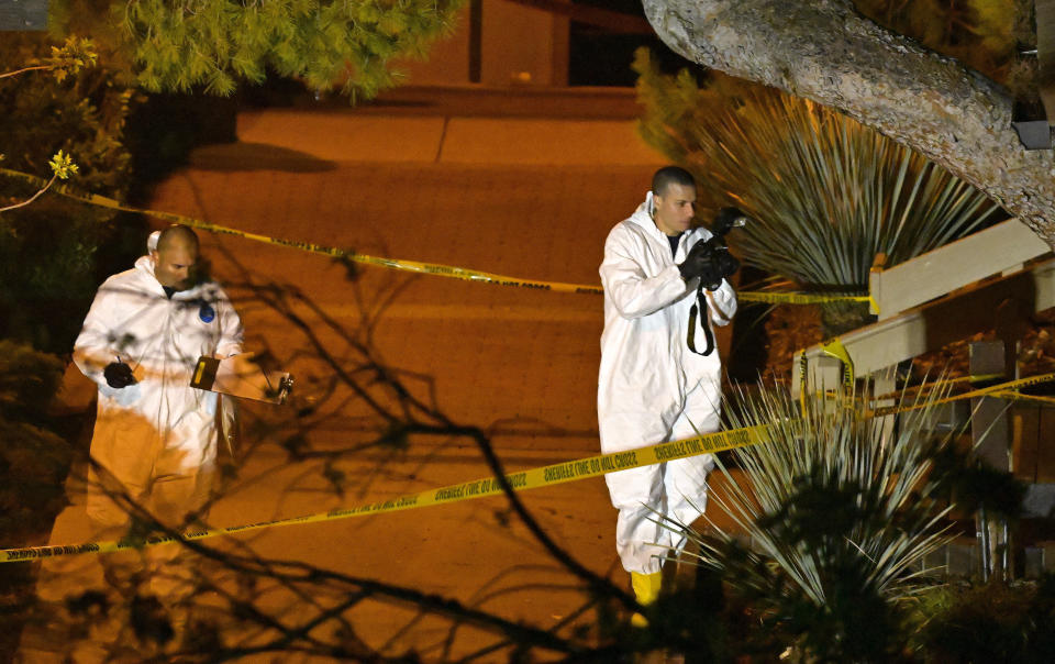 A forensics team works the scene on Thursday in Thousand Oaks.