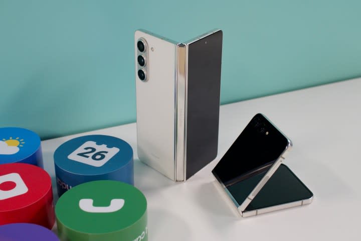 Samsung Galaxy Z Fold 5 and Galaxy Z Flip 5 next to each other on a white table.