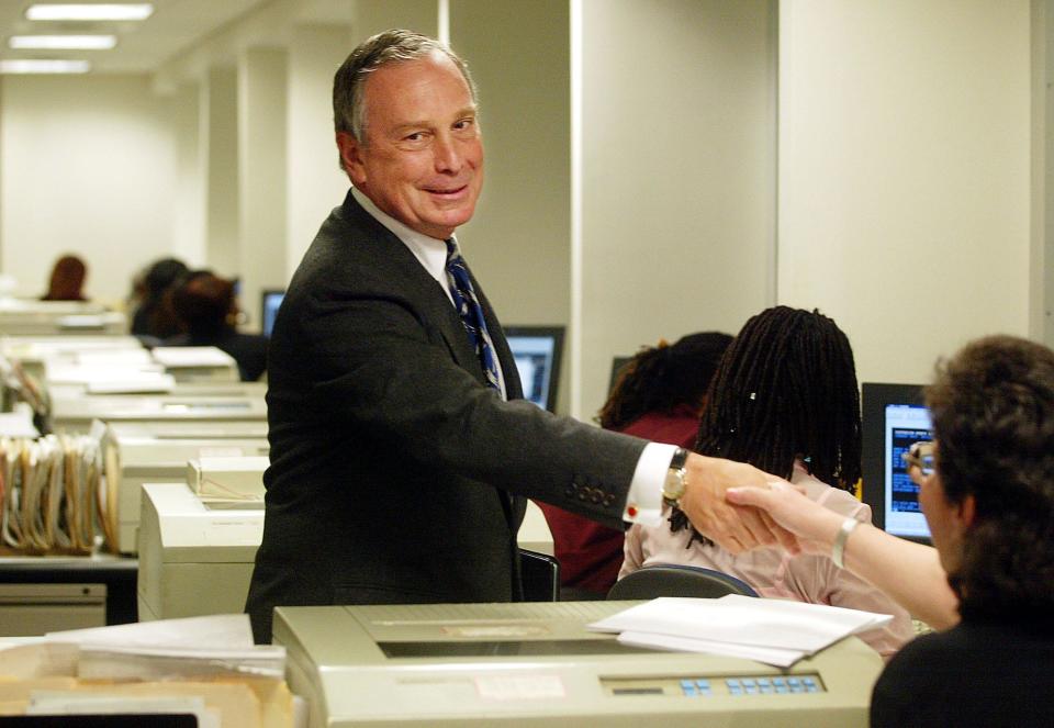 Michael Bloomberg greets workers at the Manhattan Business Center April 22, 2002 in New York City