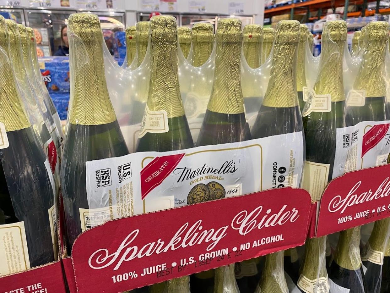 Rows of Martinellis Sparkling Cider on a shelf at Costco.