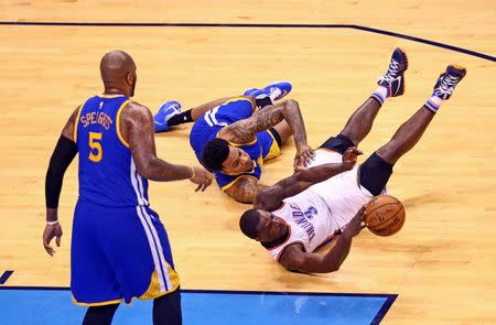 1May 22, 2016; Oklahoma City, OK, USA; Oklahoma City Thunder guard Dion Waiters (3) saves the ball in front of Golden State Warriors forward Brandon Rush (4) and center Marreese Speights (5) during the second half in game three of the Western conference finals of the NBA Playoffs at Chesapeake Energy Arena. Mandatory Credit: Kevin Jairaj-USA TODAY Sports
