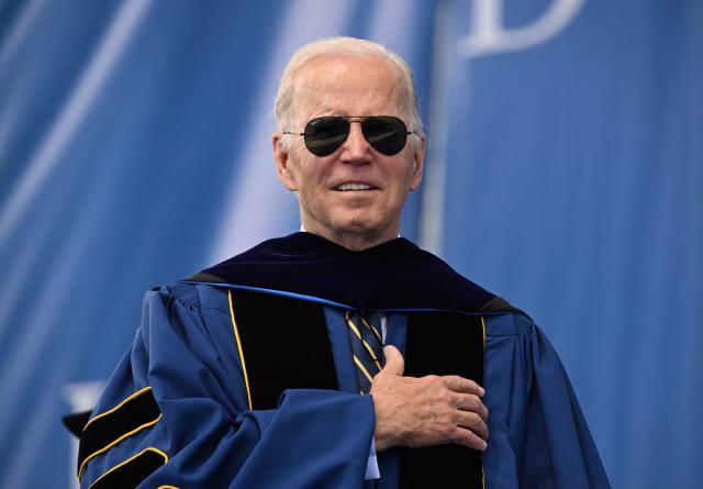 US President Joe Biden listens to the national anthem at the graduation ceremony for his alma mater, the University of Delaware, at Delaware Stadium, where he will deliver the commencement address, in Newark, Delaware, on May 28, 2022. (Photo by Mandel NGAN / AFP) (Photo by MANDEL NGAN/AFP via Getty Images)
