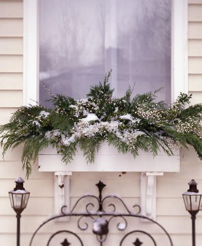 14 Holiday Planter Ideas That Will Give Guests a Warm Welcome