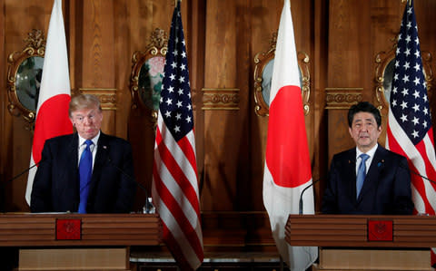 U.S. President Donald Trump and Japan's Prime Minister Shinzo Abe hold a joint news conference - Credit: REUTERS/Jonathan Ernst