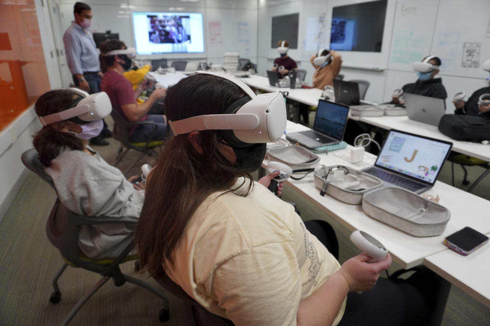 Students at the University of Miami participate in a course titled Religion and Sacred Spaces in the Era of Virtual Reality and Artificial Intelligence on April 9, 2019. (Kim Grinfeder via AP)