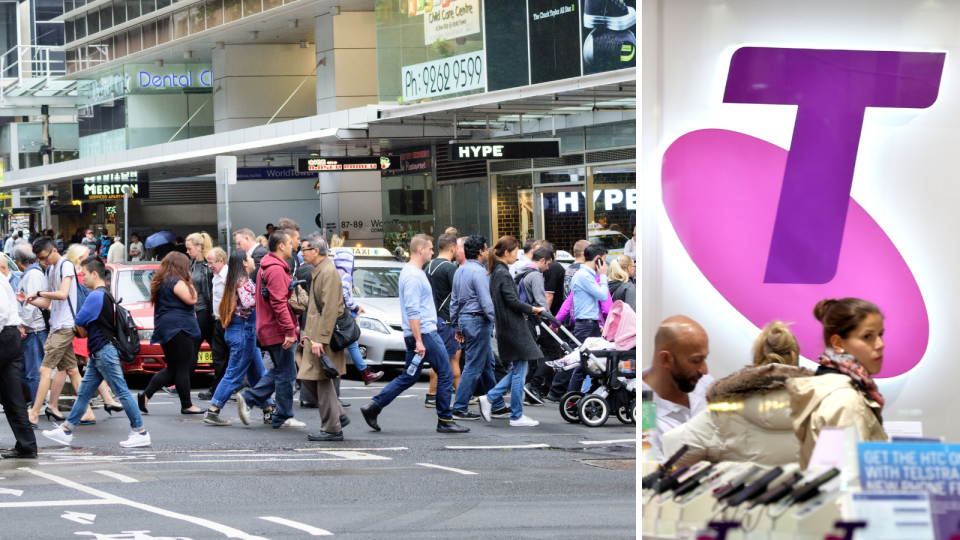 People cross a busy street in the Sydney CBD and the Telstra logo in a store.