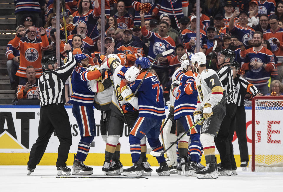 Vegas Golden Knights and Edmonton Oilers players rough it up during the third period of Game 4 of an NHL hockey second-round playoff series Wednesday, May 10, 2023, in Edmonton, Alberta. (Jason Franson/The Canadian Press via AP)