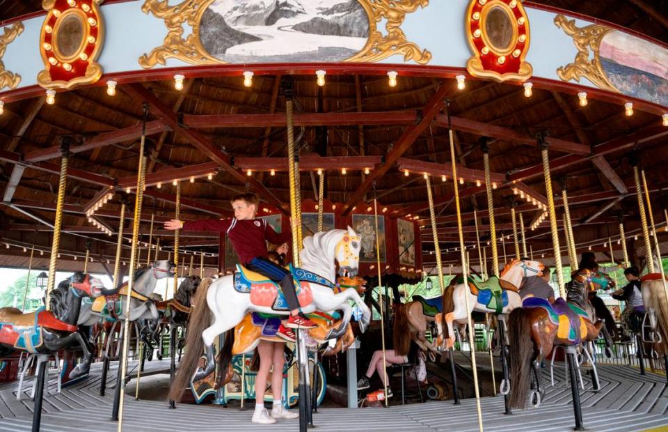 Jacob Kennedy rides the carousel at DelGrosso’s Park & Laguna Splash on Friday, June 9, 2023. The Herschell-Spillman carousel plays a Wurlitzer 146B band organ and is from 1924.