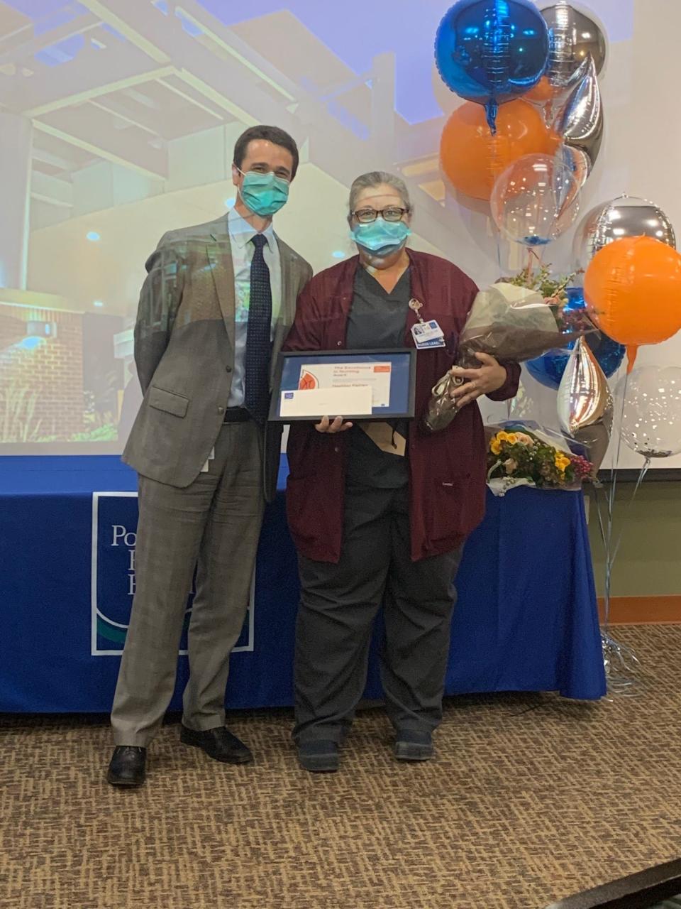 Heather Fairley of Newmarket, often called “the calm in a storm” due to her confident and approachable demeanor, received the 2021 Nursing Excellence Award for Professional Mentoring. Dean M. Carucci, CEO of Portsmouth Regional Hospital, presented her with the award.