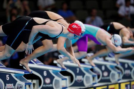 July 1, 2016; Omaha, NE, USA; Katie Ledecky dives off the starting block during the women's 800m freestyle preliminary heats in the U.S. Olympic swimming team trials at CenturyLink Center. Mandatory Credit: Erich Schlegel-USA TODAY Sports