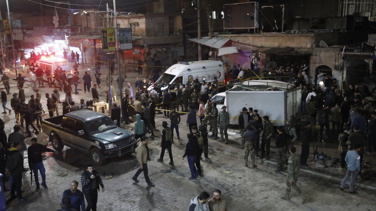 Security forces and ambulances are dispatched to the area after a bomb exploded in bustling market in area controlled by opposition forces in Azaz, Syria  (Anadolu via Getty Images)