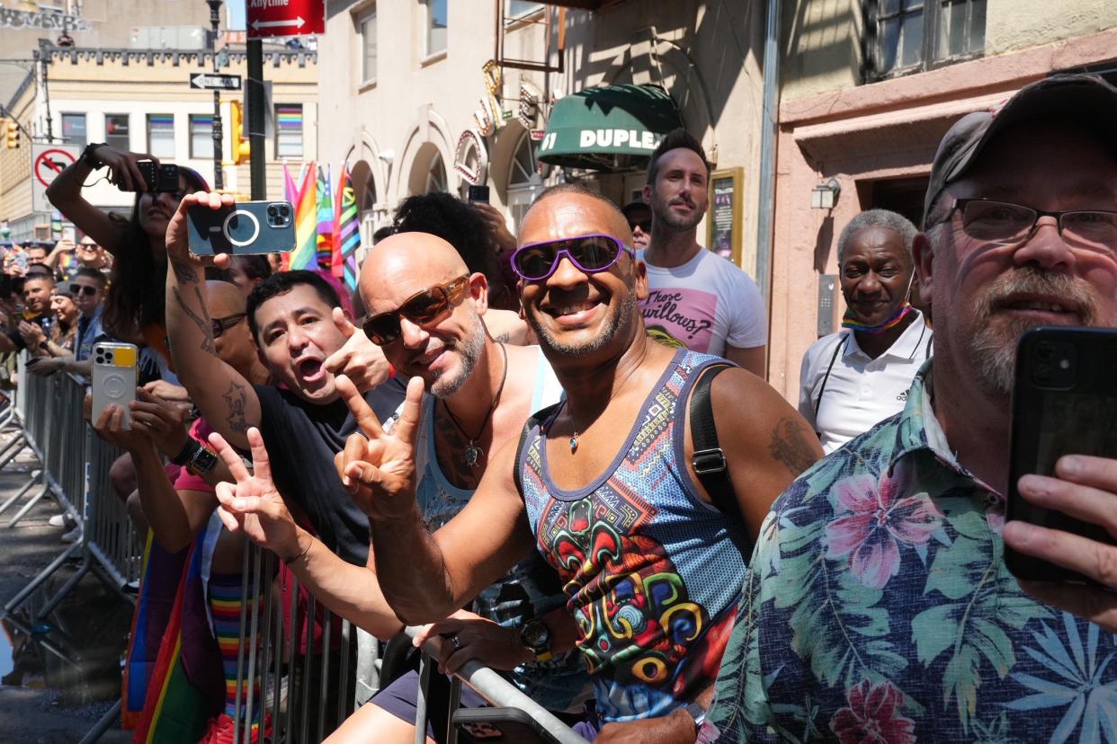 People watch the NYC Pride March on Sunday, June 26, 2022. 