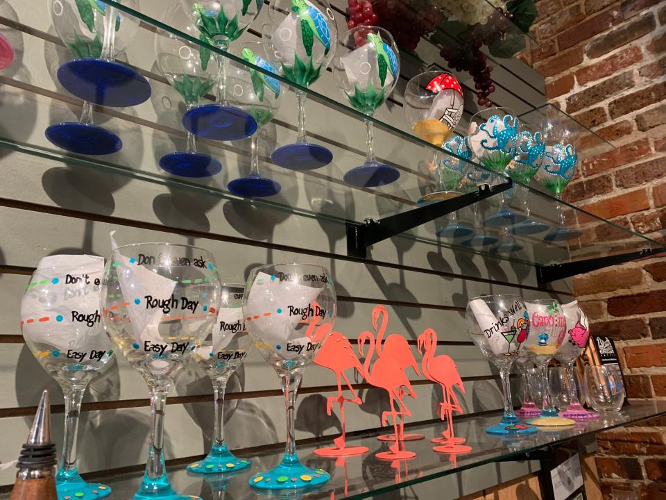 Painted wine glasses at Heart of Carolina in the Cotton Exchange. The store is struggling to get more orders of the glasses amid supply chain issues.