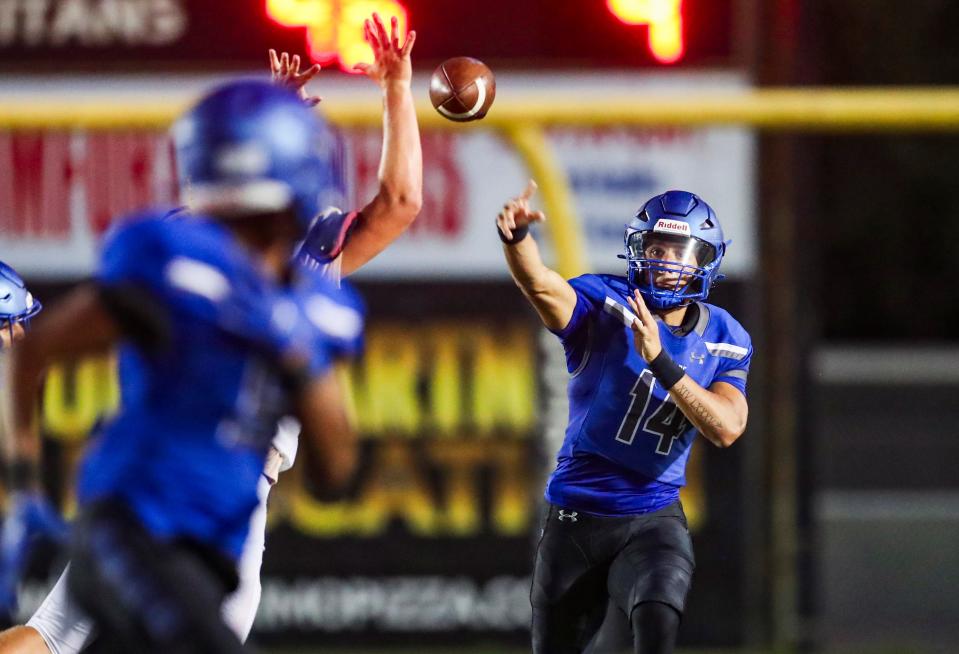 Barron Collier Cougars quarterback Niko Boyce (14) passes the ball during the fourth quarter of a game against the Charlotte Tarpons at Golden Gate High School in Naples on Tuesday, May 21, 2024.