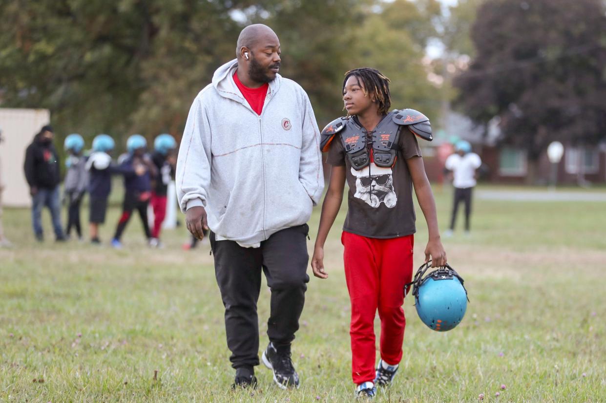 Timothy Rives a Detroit police shooting victim and his son Timothy Rives during practice the Jaguars PAL team football practice Thursday, Oct. 12 2023.