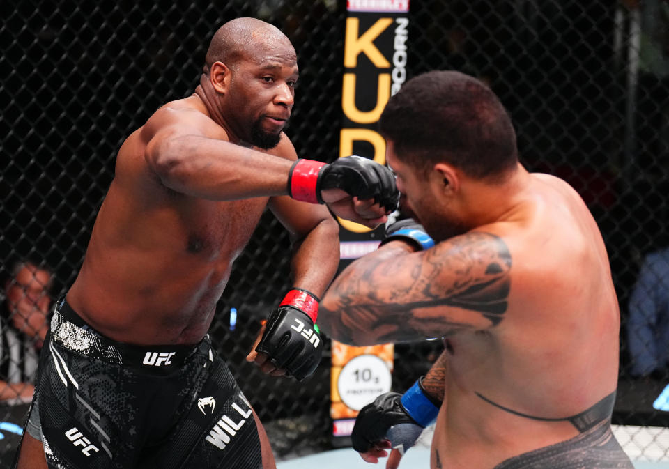 LAS VEGAS, NEVADA – MARCH 23: (L-R) Karl Williams of the U.S. Virgin Islands punches Justin Tafa of New Zealand in a heavyweight fight during the UFC Fight Night event at UFC APEX on March 23, 2024 in Las Vegas, Nevada. (Photo by Chris Unger/Zuffa LLC via Getty Images)