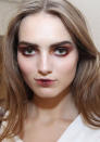 <b>Behind-the-scenes at Oscar de la Renta's AW13 New York Fashion Week show<br></b><br>Smudged burgundy eyes with little or no mascara, and Geisha-style lips in a matching hue are seen backstage.<br><br>©Rex<br>