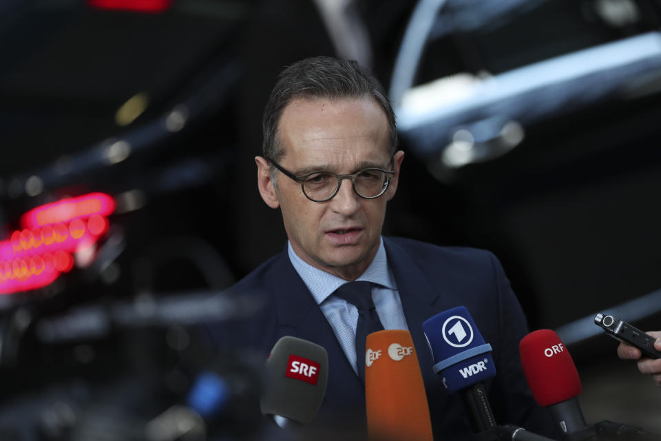 Germany's Foreign Minister Heiko Maas speaks with the media as he arrives to an EU Foreign Ministers meeting at the European Council headquarters in Brussels, Monday, Feb. 18, 2019. US President Donald Trump's demand that European countries take back their nationals fighting in Syria is receiving mixed reactions, as nations pondered how to bring home-grown Islamic State extremists to trial. (AP Photo/Francisco Seco)