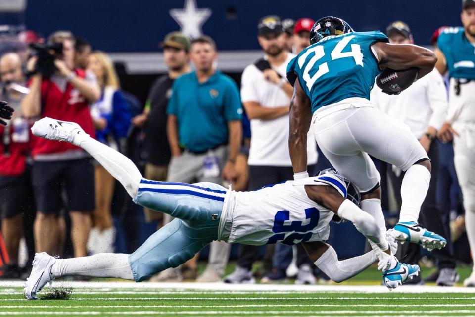 Dallas Cowboys corner back Myles Brooks (39) goes for a tackle on Jacksonville Jaguars running back Snoop Conner (24) in the third quarter at AT&T Stadium in Arlington, Texas on Saturday, Aug. 12, 2023. Chris Torres/ctorres@star-telegram.com