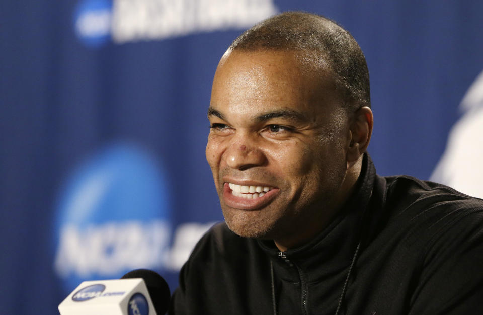 FILE - Harvard coach Tommy Amaker smiles while speaking at a news conference at the NCAA men's college basketball tournament in Spokane, Wash., March 21, 2014. Former President Barack Obama returned to Cambridge, Mass., Friday, Sept. 9, 2022, to attend “The Breakfast Club,” a group formed by Amaker with law professors Charles Ogletree and Ron Sullivan to create a community of Black leaders and connect it with his team. (AP Photo/Elaine Thompson, File)