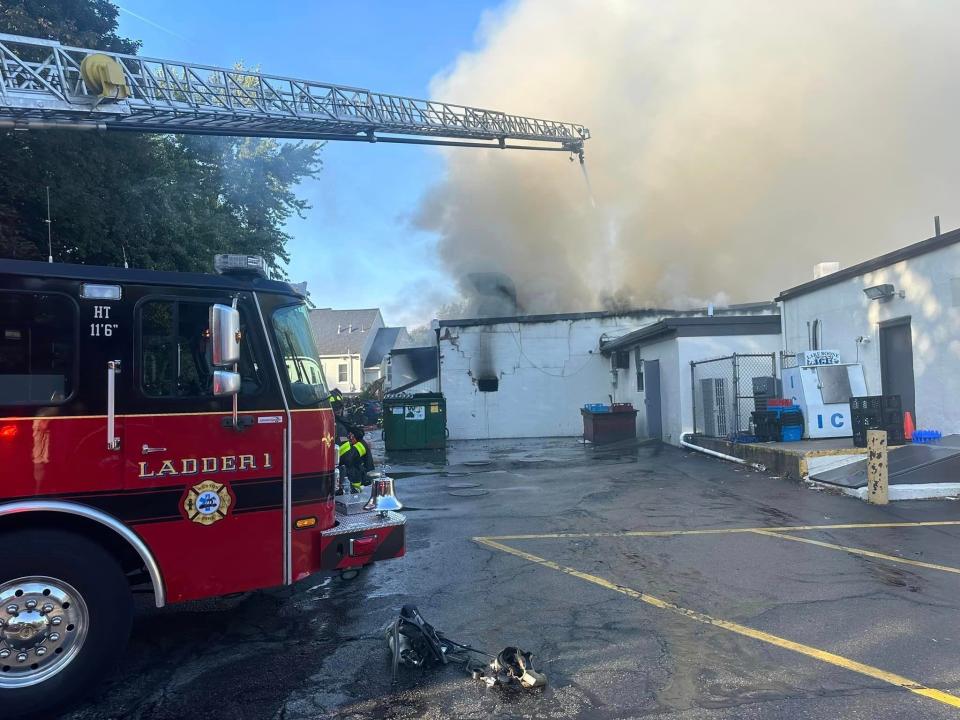Firefighters from 10 area departments responded Tuesday afternoon to a five-alarm fire at a strip mall on Main Street (Route 27) in Wayland.