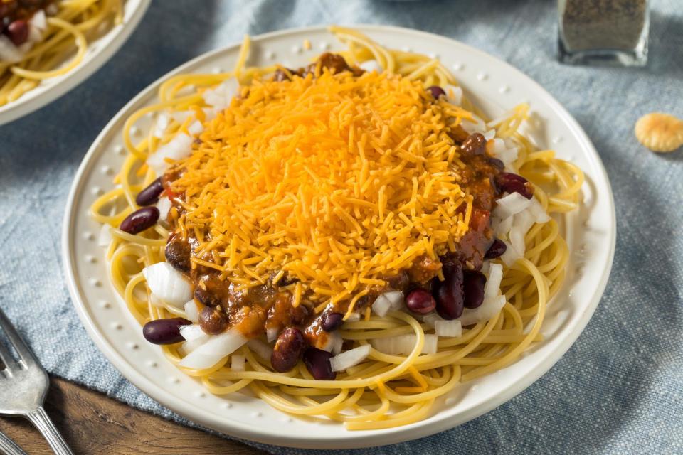 <p>Cincinnati chili — that no-bean, sweet ground beef concoction, piled on top of spaghetti and served with ample amounts of cheddar cheese — is often misunderstood. But don’t knock it till you try it. It’s one of <a href="https://www.thedailymeal.com/eat/regional-american-chili-styles?referrer=yahoo&category=beauty_food&include_utm=1&utm_medium=referral&utm_source=yahoo&utm_campaign=feed" rel="nofollow noopener" target="_blank" data-ylk="slk:the most famous regional chilis in America;elm:context_link;itc:0;sec:content-canvas" class="link ">the most famous regional chilis in America</a> for a reason.</p> <p><a href="https://www.thedailymeal.com/best-recipes/copycat-cincinnati-chili?referrer=yahoo&category=beauty_food&include_utm=1&utm_medium=referral&utm_source=yahoo&utm_campaign=feed" rel="nofollow noopener" target="_blank" data-ylk="slk:For the Cincinnati Chili recipe, click here.;elm:context_link;itc:0;sec:content-canvas" class="link ">For the Cincinnati Chili recipe, click here.</a></p>