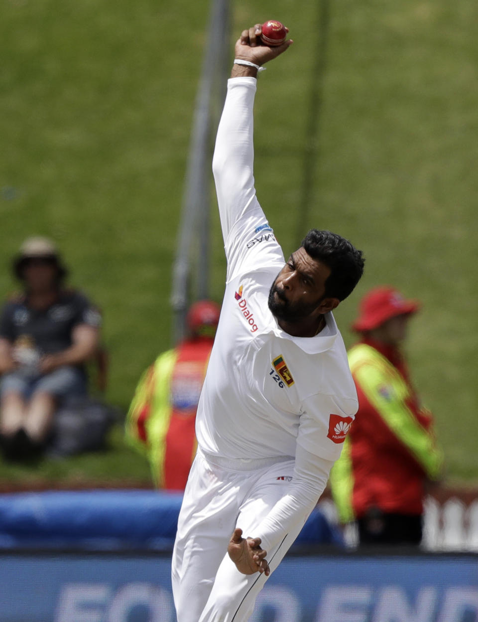 Sri Lanka's Dilruwan Perera bowls during play on day three of the first cricket test between New Zealand and Sri Lanka in Wellington, New Zealand, Monday, Dec. 17, 2018. (AP Photo/Mark Baker )