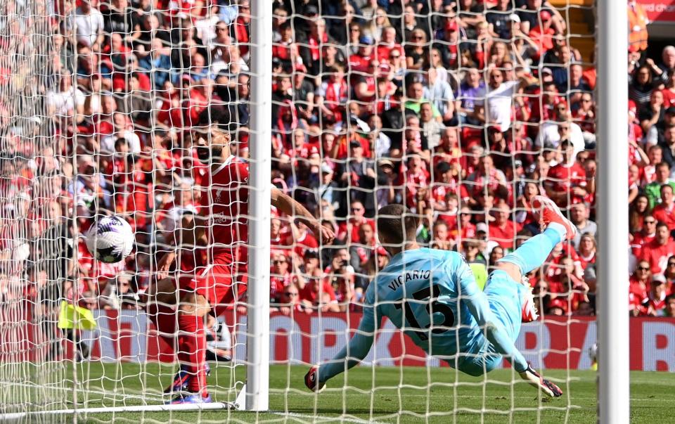 Mohamed Salah of Liverpool scores his team's first goal during the Premier League match between Liverpool FC and Tottenham Hotspur