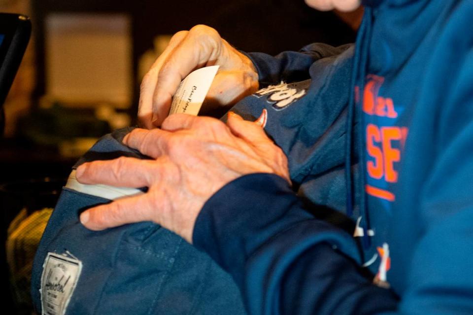 Jim McIngvale, better known as ‘Mattress Mack’, puts his ticket for a $500,000 bet on the winner of the NCAA Men’s Basketball Tournament into his famous Astros backpack at the Beau Rivage Casino in Biloxi on Tuesday, Nov. 15, 2022.