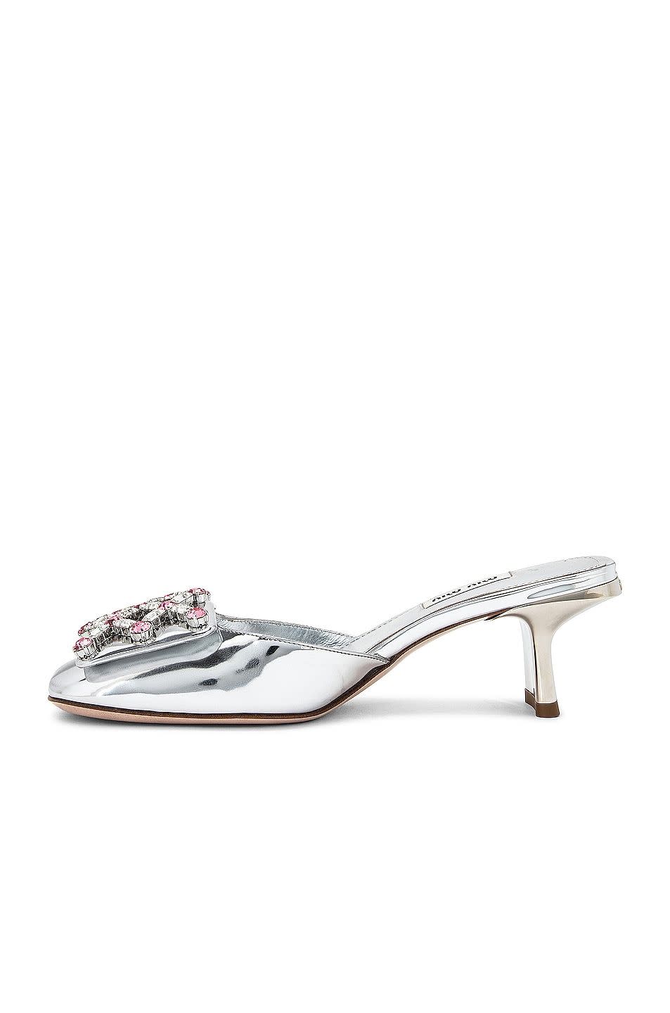 <p><a href="https://go.redirectingat.com?id=74968X1596630&url=https%3A%2F%2Fwww.fwrd.com%2Fproduct-miu-miu-metallic-sandals-in-argento%2FMIUF-WZ70%2F&sref=https%3A%2F%2F" rel="nofollow noopener" target="_blank" data-ylk="slk:Shop Now;elm:context_link;itc:0;sec:content-canvas" class="link rapid-noclick-resp">Shop Now</a></p><p>Metallic Sandals</p><p>$995.00</p><p>fwrd.com</p><span class="copyright">Courtesy of FWRD</span>