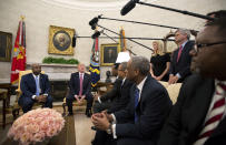 FILE - In this Feb. 14, 2018, file photo, President Donald Trump, with Sen. Tim Scott, R-S.C., left, Ivanka Trump, top second from right, and Steve Case, top right, participate in a working session regarding the opportunity zones provided by tax reform in the Oval Office of the White House in Washington. An Associated Press investigation found Trump’s daughter and son-in law stand to benefit from a program they pushed that offers massive tax breaks to developers who invest in downtrodden American areas. (AP Photo/Manuel Balce Ceneta, File)