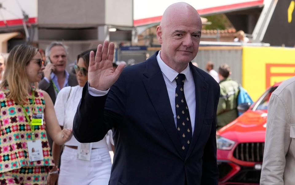 FIFA president Gianni Infantino waves in the Monaco paddock