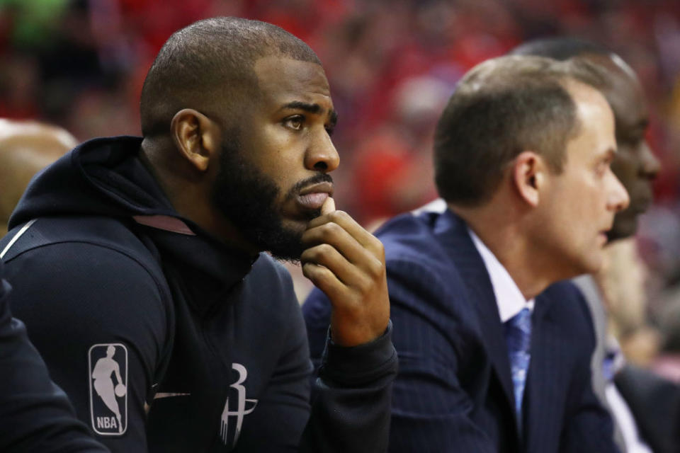 Chris Paul sits, and watches. (Getty)