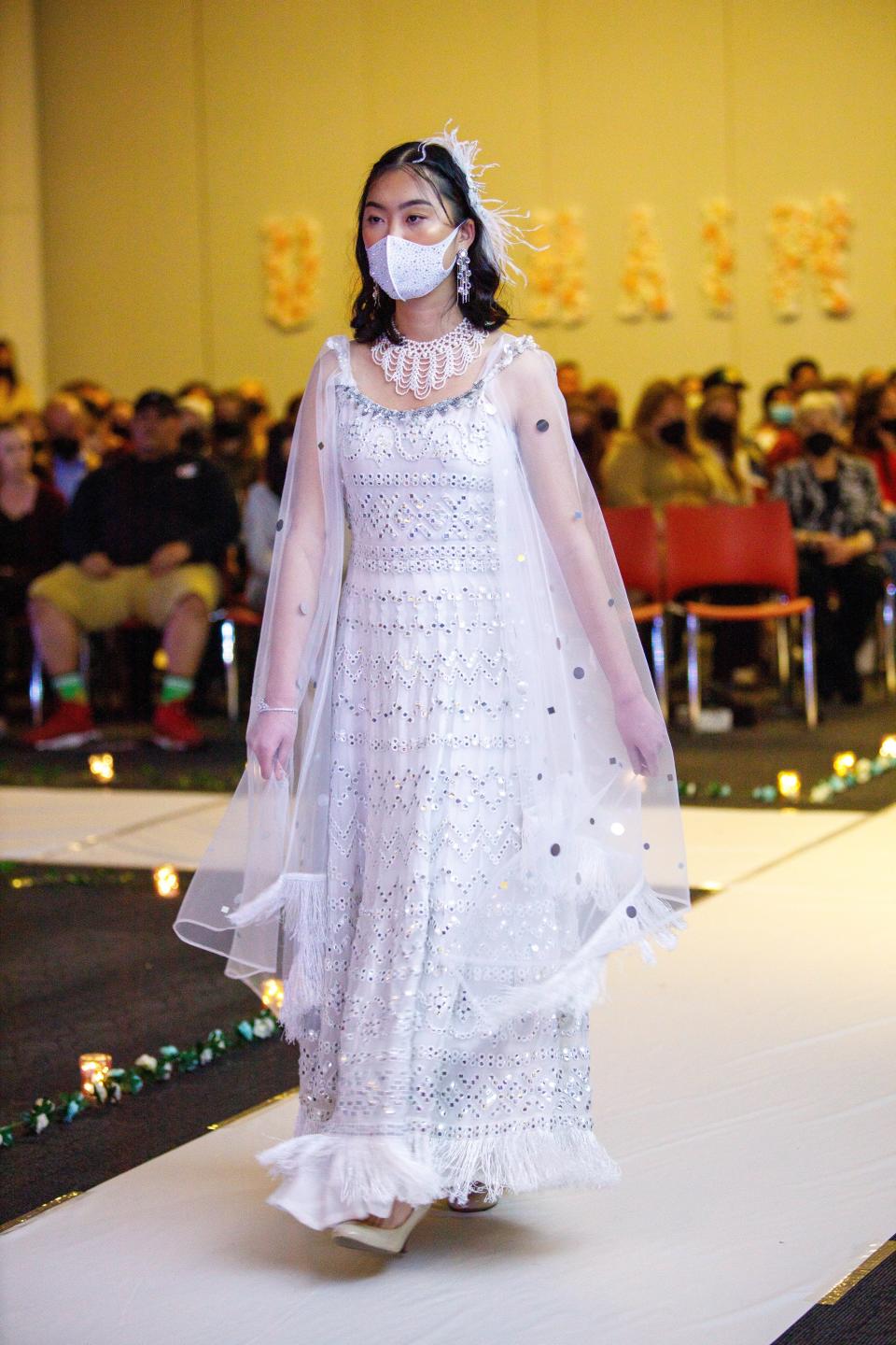 A model wears a dress by Anjali Phougat at the 2022 Unchained fashion show at Ohio State Univesity.