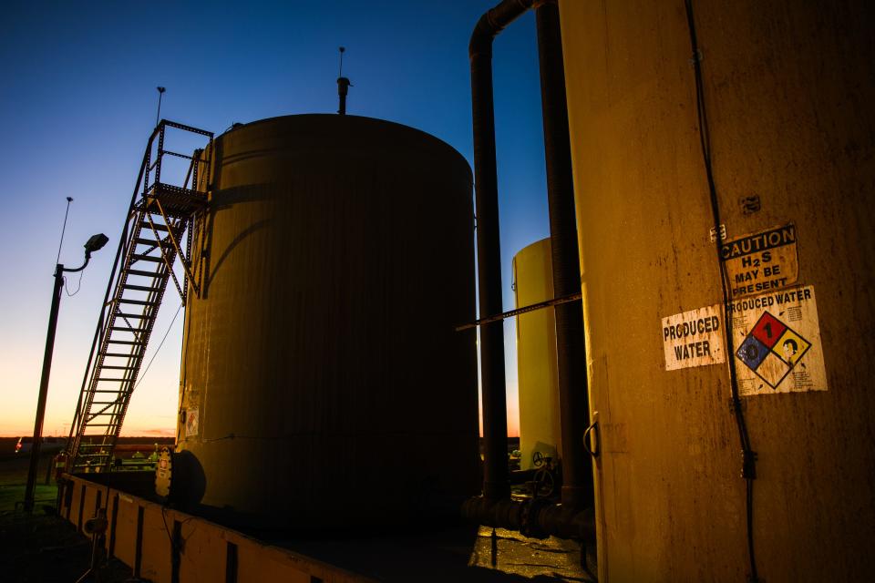 A produced water tank sits as part of a tank battery at an injection well site Monday, Jan. 31, 2022 outside of Odessa.