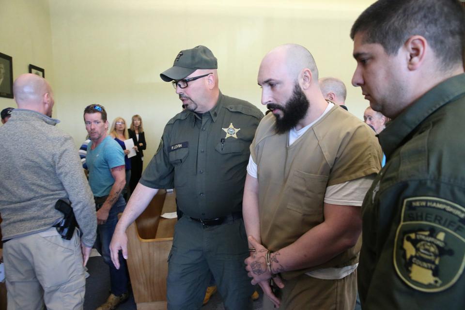 Joshua McCarthy of Rochester is escorted out of Strafford County Superior Court in Dover Wednesday, May 10, 2023 after being sentenced through a plea deal for negligent homicide in the deaths of James Hughes Sr., 64, and Suzanne Hughes, 59.