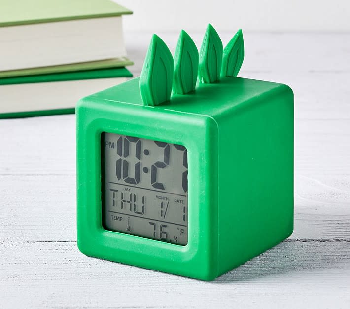 Kids alarm clock shaped like a dinosaur