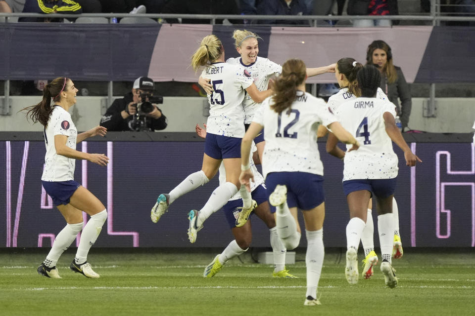 United States defender Jenna Nighswonger, center right, celebrates with teammates after her goal during the first half of a CONCACAF Gold Cup women's soccer tournament quarterfinal against Colombia, Sunday, March 3, 2024, in Los Angeles. (AP Photo/Marcio Jose Sanchez)