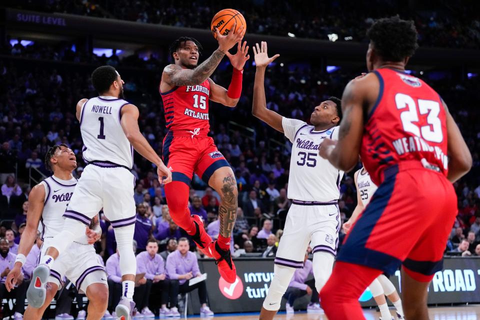 Florida Atlantic guard Alijah Martin (15) attempts a shot as Kansas State forward Nae'Qwan Tomlin (35) defends during the first half of their NCAA men's tournament game at Madison Square Garden.