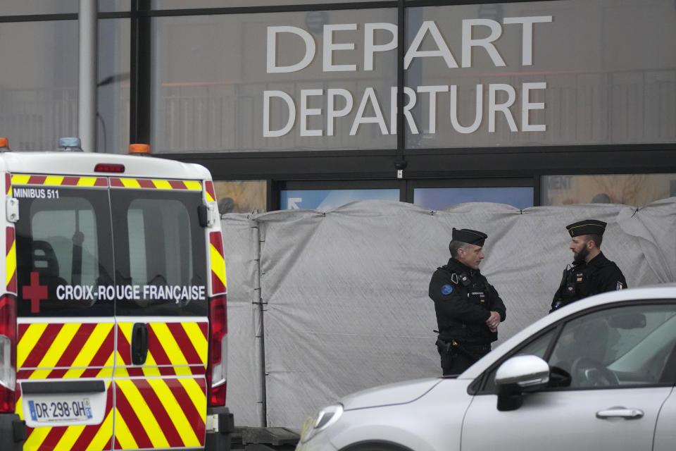 Gendarmes guard the closed entrance of the Vary airport, Monday, Dec. 25, 2023 in Vatry, eastern France. A charter plane carrying 303 Indians to Nicaragua was authorized Sunday to leave a French airport where it has been grounded for four days for a human trafficking investigation. A lawyer for the airline said the plane is taking many of the stranded passengers back to India on Monday. (AP Photo/Christophe Ena)