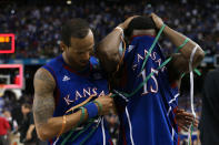 Travis Releford #24 and Elijah Johnson #15 of the Kansas Jayhawks react after losing to the Kentucky Wildcats 67-59 in the National Championship Game of the 2012 NCAA Division I Men's Basketball Tournament at the Mercedes-Benz Superdome on April 2, 2012 in New Orleans, Louisiana. (Photo by Jeff Gross/Getty Images)