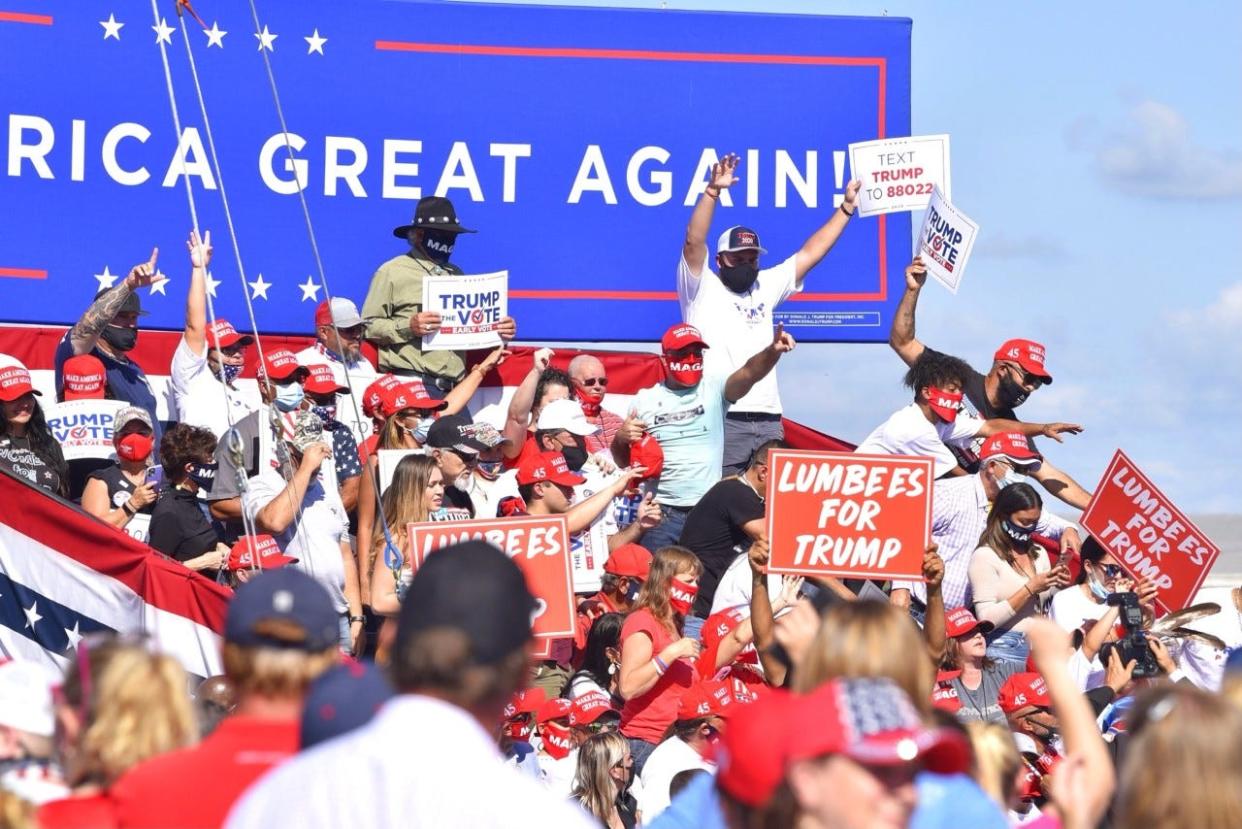 People await President Donald Trump's arrival Saturday, Oct. 24, 2020, at the Robeson County Fairgrounds in Lumberton.