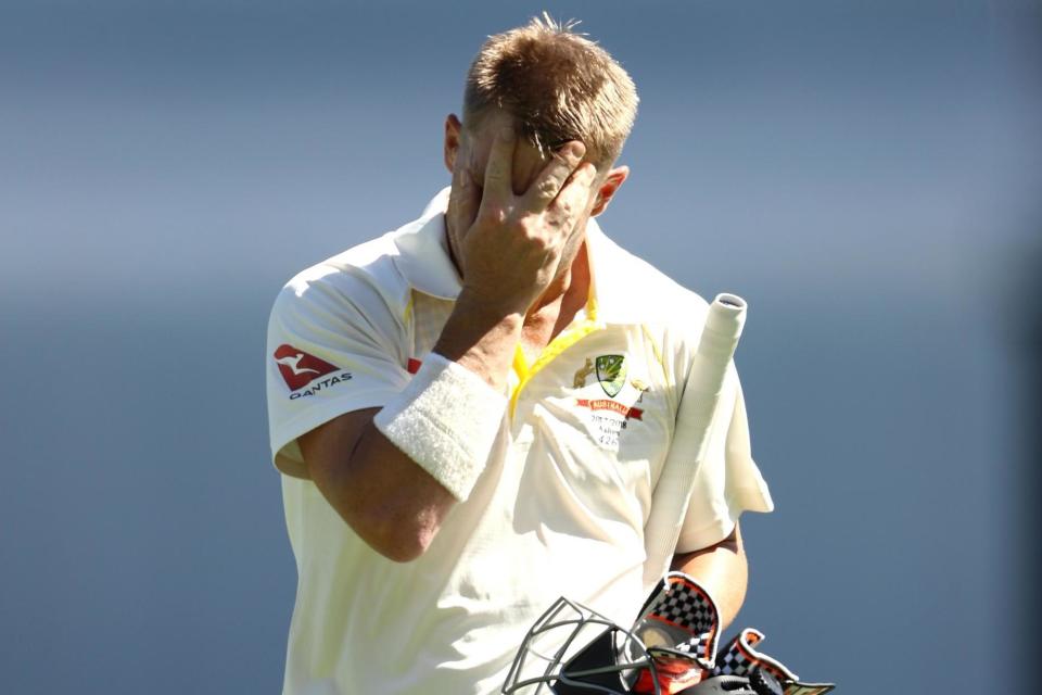 Out cheaply: Warner walks from the middle after being dismissed by Ball: Getty Images