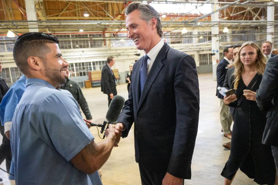 Ryan Pagan, an inmate at San Quentin State Prison, talks to Gov. Gavin Newsom on Friday. Newsom announced that by 2025, San Quentin will be converted from a maximum-security prison to a rehabilitation and education facility.