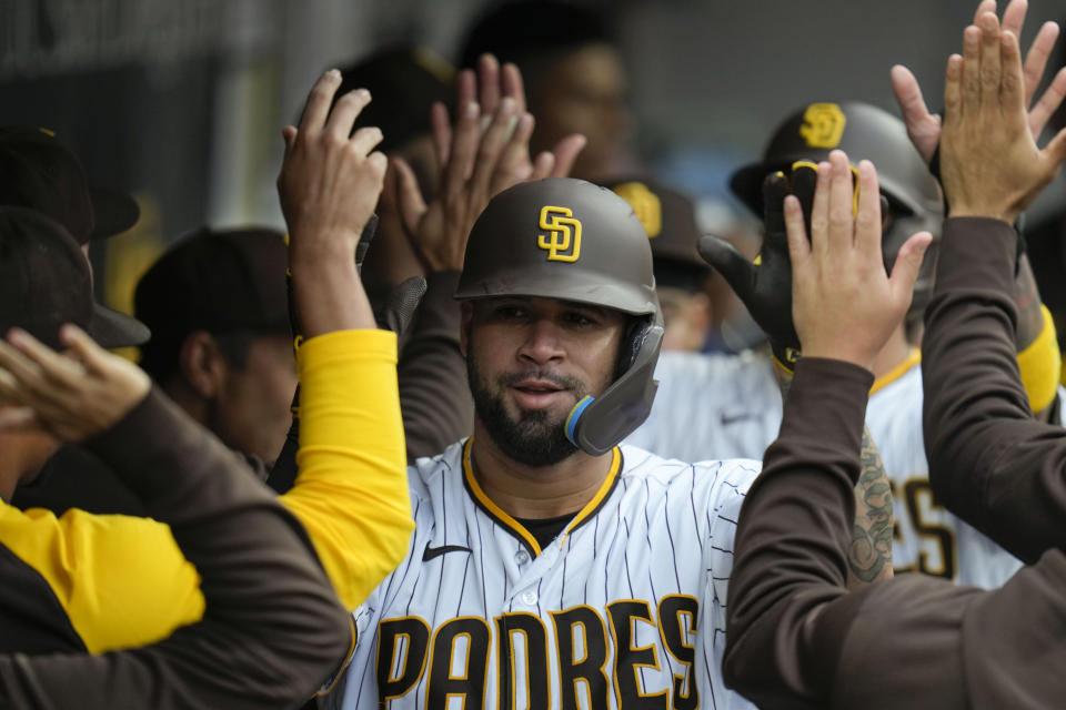 San Diego Padres' Gary Sanchez celebrates with teammates in the dugout after hitting a two-run home run during the second inning of a baseball game against the Chicago Cubs, Monday, June 5, 2023, in San Diego. (AP Photo/Gregory Bull)