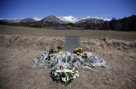 Flowers are seen at the memorial for the victims of the air disaster in the village of Le Vernet, near the crash site of the Airbus A320 in French Alps March 27, 2015.REUTERS/Eric Gaillard