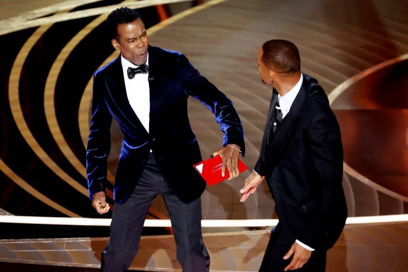 HOLLYWOOD, CA - March 27, 2022. Chris Rock and Will Smith onstage during the show at the 94th Academy Awards at the Dolby Theatre at Ovation Hollywood on Sunday, March 27, 2022. (Myung Chun / Los Angeles Times)