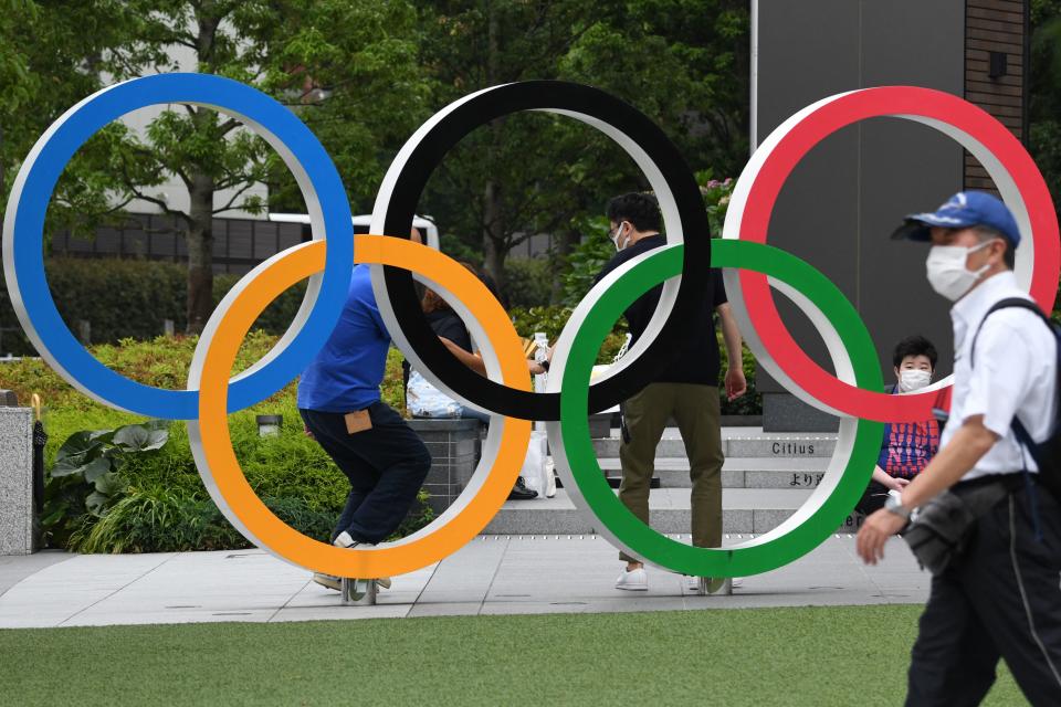 The Olympic rings is displayed near the National Stadium, main venue for the Tokyo 2020 Olympic and Paralympic Games in Tokyo on July 7, 2021, as reports said the Japanese government plans to impose a virus state of emergency in Tokyo during the Olympics. (Photo by Kazuhiro NOGI / AFP) (Photo by KAZUHIRO NOGI/AFP via Getty Images)