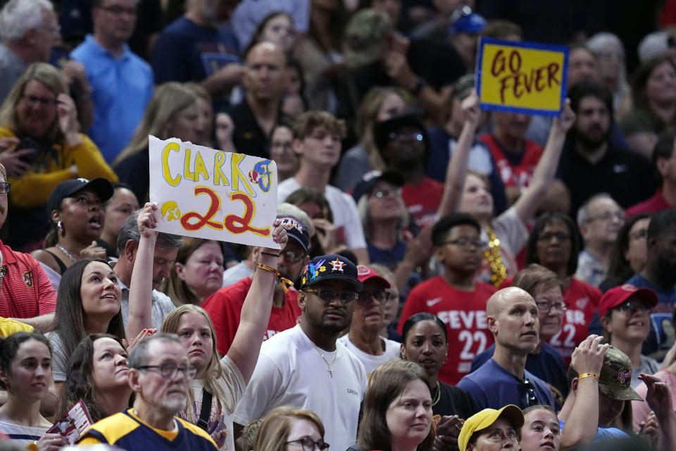 A fan holds up a Indiana Fever's Caitlin Clark sign during the second half of a WNBA basketball game against the New York Liberty, Saturday, July 6, 2024, in Indianapolis. (AP Photo/Darron Cummings)